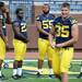 Michigan running back Derrick Green stands with teammates defensive end Taco Charlton and offensive lineman David Dawson as they wait to have their photo taken at the stadium on Sunday, August 11, 2013. Melanie Maxwell | AnnArbor.com